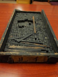 Photo of a box of movable type. Each movable type represents one Chinese character.