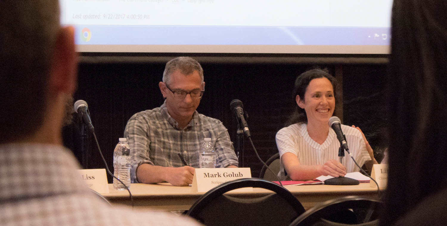 two faculty speak during a discourse series lecture.