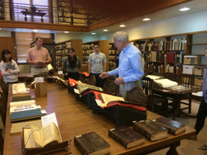 Students examine rare books in the reading room