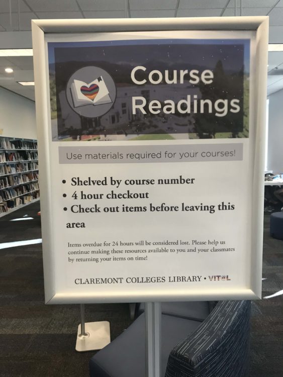 Large poster in a frame. The poster is titled "Course Readings."