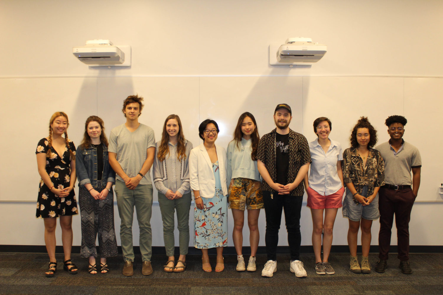 10 students lined up to celebrate their achievements as winners of the 2019 Library Undergraduate Research Awards.