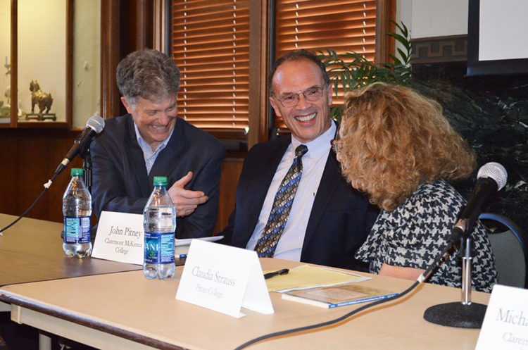 image of 3 faculty talking at a table