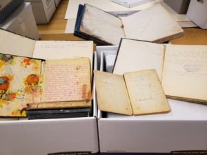 Several manuscript items open to display contents